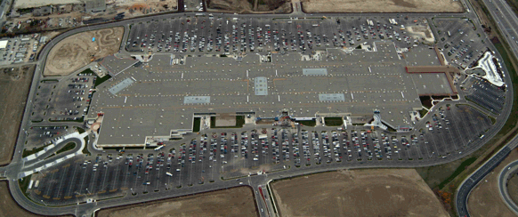 Aerial view of a large shopping center and the surrounding parking lot
